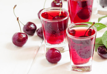 Fresh cherry juice with berries, selective focus