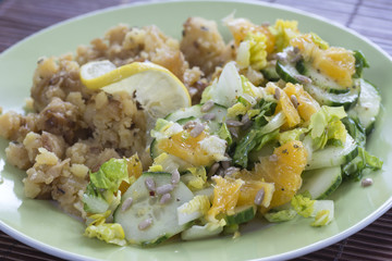 Mashed potatoes with salad ing of cucumbers and oranges II