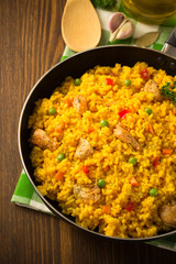 frying pan full of rice on wood