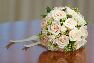 beautiful bridal bouquet of roses at a wedding party