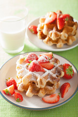 belgian waffles with icing sugar and strawberry