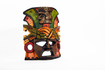 Indian Mayan Aztec wooden mask with anaconda and jaguar isolated on white background (right side presentation layout)