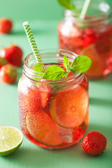summer strawberry drink with lime and mint in jars