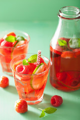 Fototapeta na wymiar summer strawberry raspberry drink with lime and mint