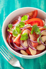 healthy tomato salad with white beans onion coriander