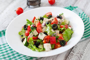 Greek salad with fresh vegetables, feta cheese and black olives