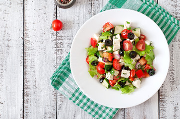 Greek salad with fresh vegetables, feta cheese and black olives
