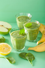healthy green smoothie with spinach leaves apple lemon banana