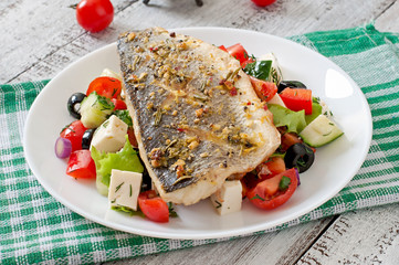 Baked seabass with Greek salad. 