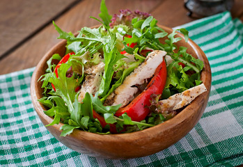 Dietary salad with chicken, arugula and sweet red pepper
