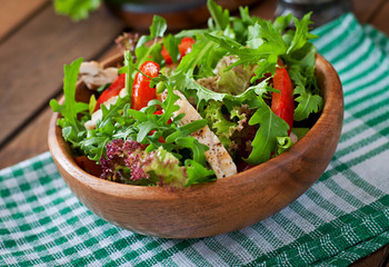 Dietary salad with chicken, arugula and sweet red pepper