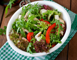Dietary salad with chicken, cheese feta arugula and sweet red pepper