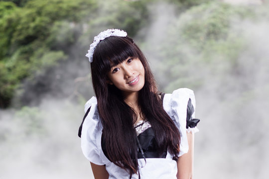 Asian Woman In Maid Outfit