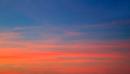 Sunset sky in red orange and blue background