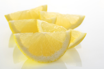 Lemon Wedges Slices on White Plate