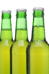 Three Green Beer Bottles with Condensation