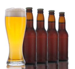 Four Brown Beer Bottles and Full Glass