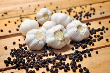 
Garlic and pepper on a wooden background