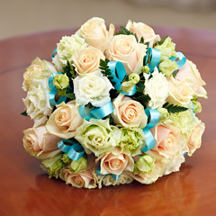 beautiful bridal bouquet of roses at a wedding party