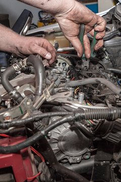 Mechanic working on engine