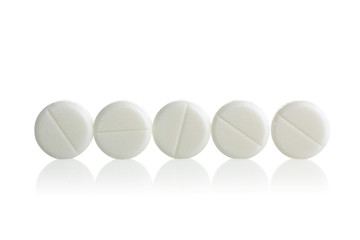 White pills isolated on white background