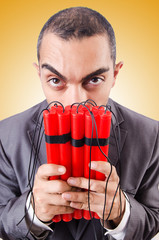 Businessman with dynamite against the gradient