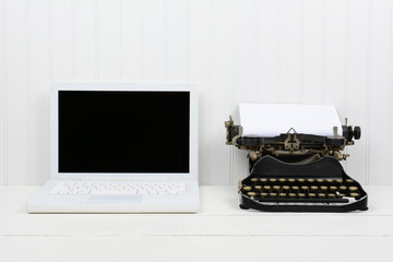 Modern Laptop and Antique Typewriter