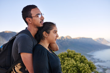 Loving Indian couple standing together on a nature hike