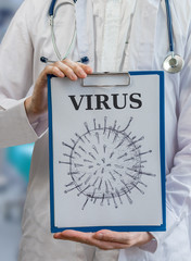 Immunologist doctor holds clipboard with virus drawing to explain immune system