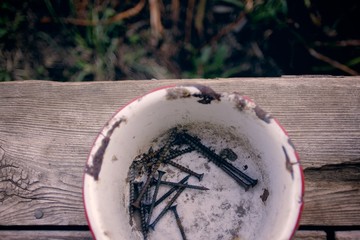 Screws in a Bucket: extra parts waiting to be used, sitting on a window sill.