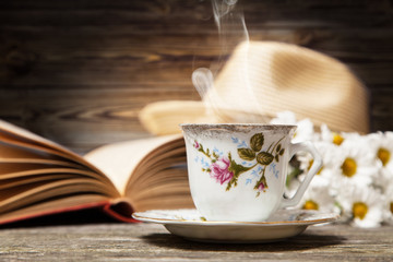 Coffee, daisies and a book