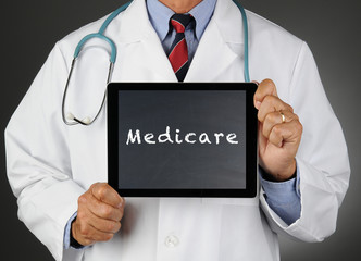 Doctor With Tablet Computer Medicare - obrazy, fototapety, plakaty