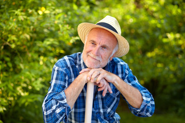Fototapeta premium Senior man in garden take a break