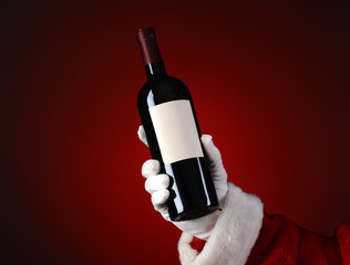 Santa Holding Wine Bottle