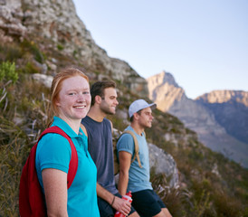 Young woman with student friends on a nature trail hike