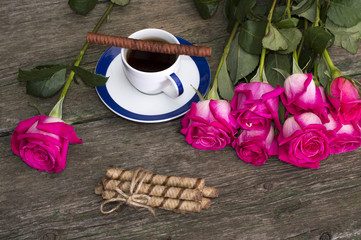 still life pink roses row coffee and cookies