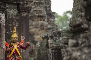 Hindu deity with hands gestures reenacted by an actor in colorfu