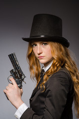 Pretty girl wearing retro hat isolated on gray