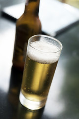 Glass of beer on table
