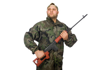 Fototapeta premium Young man in soldier uniform holding gun isolated on white