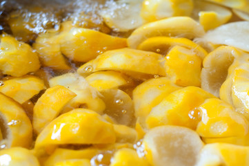Close of oranges submerged in water