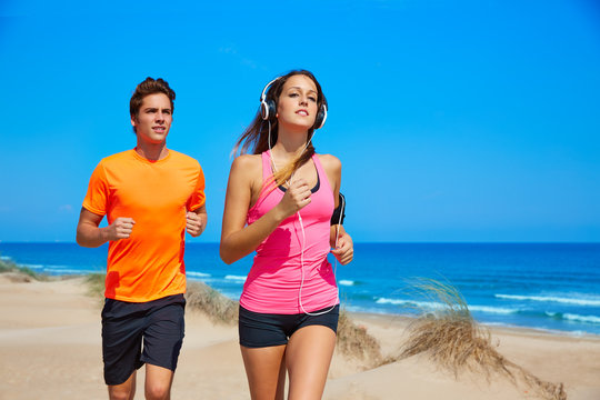 Couple young running in the beach in summer