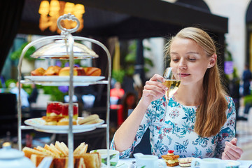 Beautiful young woman in French restaurant
