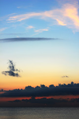 Dramatic sunrise at sea, clear and cloudy sky