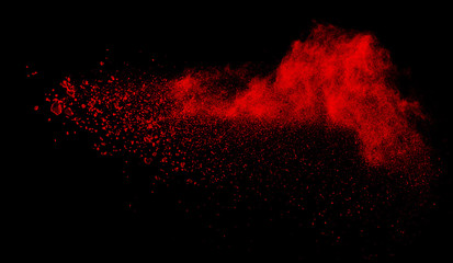 Fototapeta na wymiar Launched colorful powder, isolated on black background