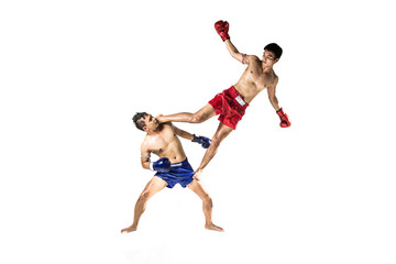 Fototapeta premium Two thai boxers exercising traditional martial art