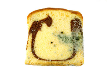Moldy sliced bread loaf over a white background.