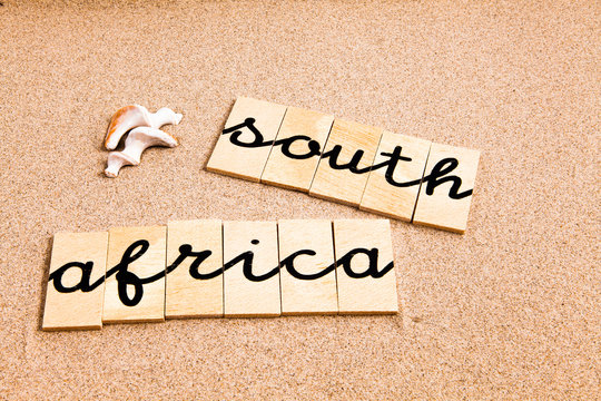 Words formed from small pieces of wood containing a sun and beach tourist destination, South Africa