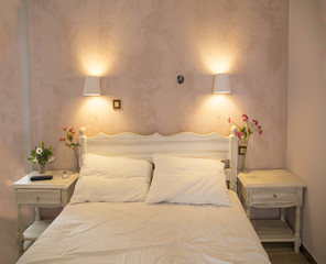 hotel bed, pink room , lights