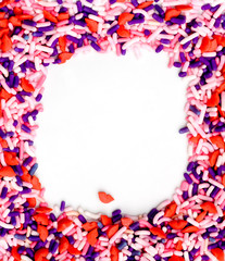 Sweet candy sprinkles background with red lips shapes